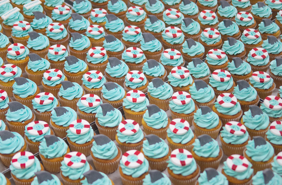 Bespoke Corporate Sharkfest Logo Cupcakes swimming around London!
